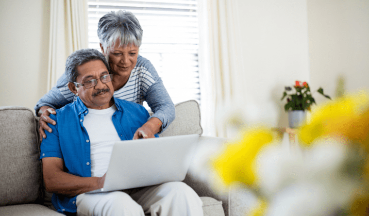 elder couple looking the laptop