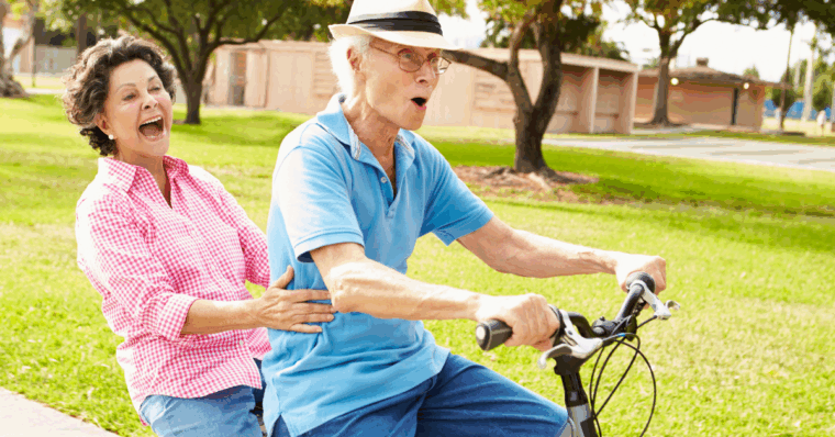 older people riding a bike