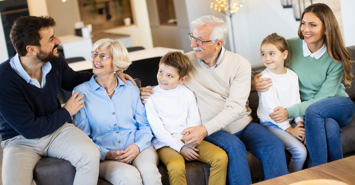 a couole of senior with their Families at Assisted Living